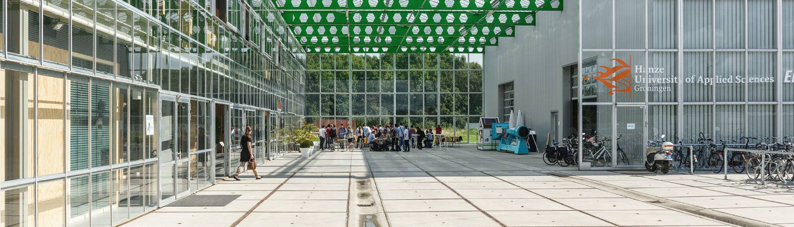 People sitting in a covered outdoor area at the EnTranCe Energy Fieldlab